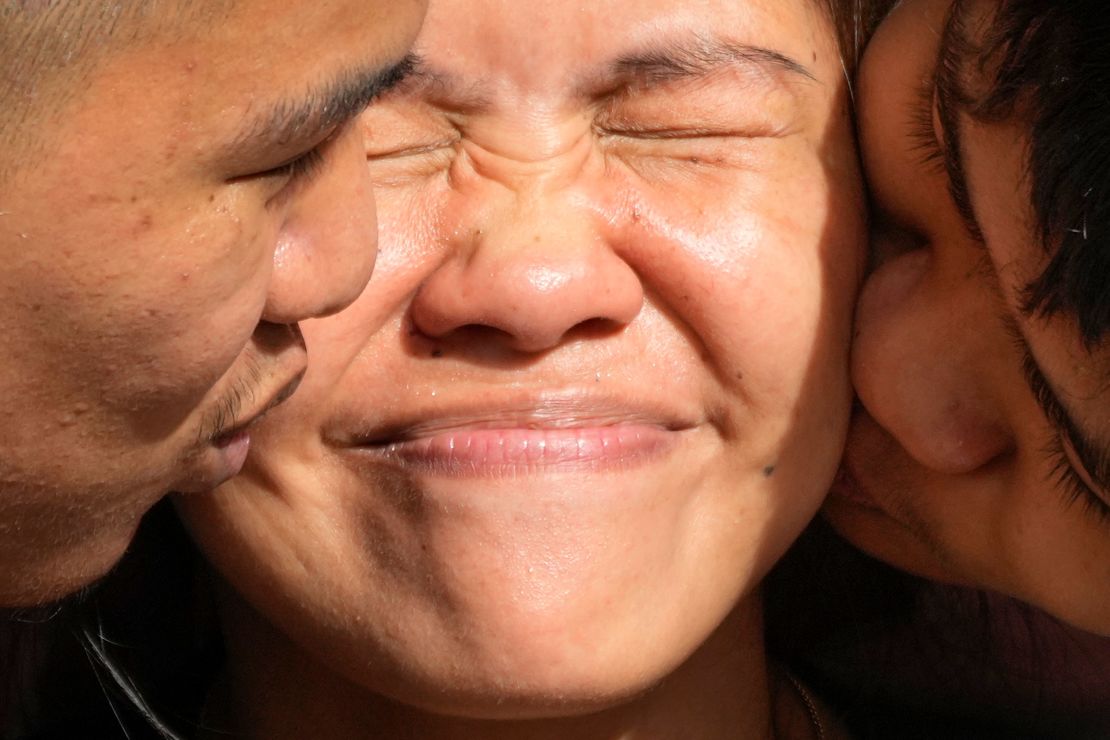 Mary Jane Veloso is kissed by her sons after being reunited at the Correctional Institution for Women in Mandaluyong, Philippines, on December 18.