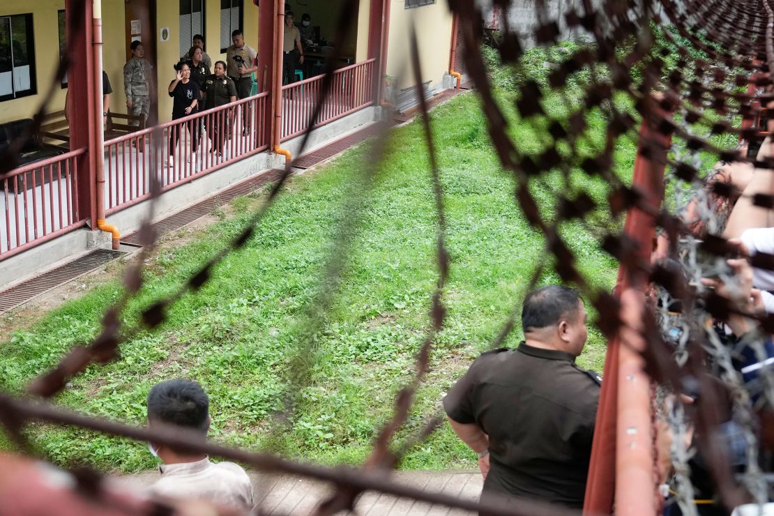 Mary Jane Veloso waves to reporters as she is processed at the Correctional Institution for Women in Mandaluyong, Philippines, on 18 December, 2024.