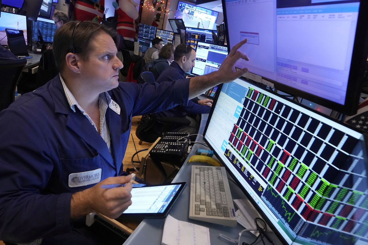 Trader Michael Milano works on the floor of the New York Stock Exchange, Wednesday, Dec. 18, 2024.