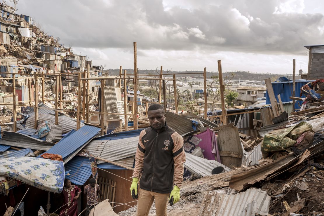 Nassirou Hamidouni, 28, stands amongst the debris in Kaweni on the outskirts of Mamoudzou, Mayotte, on December 19.