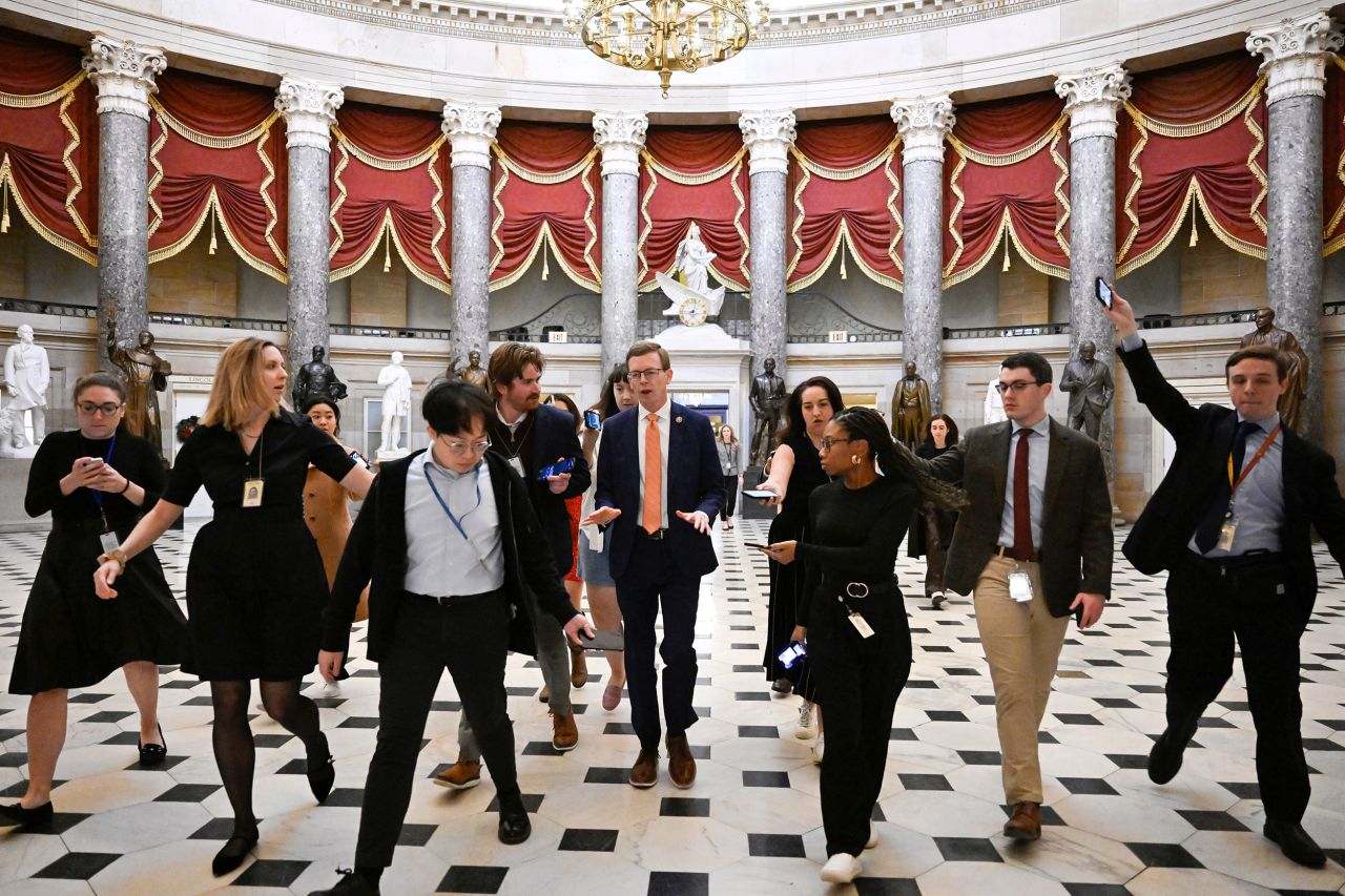 Rep. Dusty Johnson talks with reporters after attending a meeting with Speaker Mike Johnson on Friday, December 20, at the Capitol in Washington.