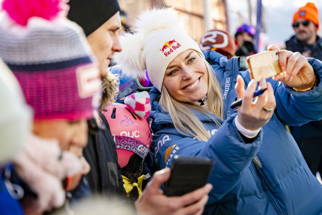 Lindsey Vonn takes a selfie in the finish area after completing an alpine ski, women's World Cup super G, in St. Moritz, Switzerland, on December 21, 2024.