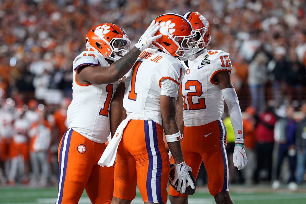 Clemson wide receiver T.J. Moore celebrates with teammates after catching a seven-yard touchdown pass during the second half.