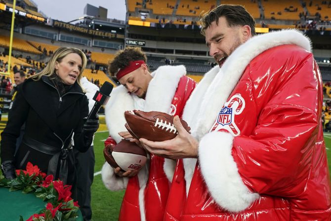 Kansas City Chiefs quarterback Patrick Mahomes and tight end Travis Kelce eat football-shaped cake after <a href="index.php?page=&url=https%3A%2F%2Fwww.cnn.com%2F2024%2F12%2F25%2Fsport%2Fchiefs-ravens-win-christmas-day-spt%2Findex.html">a 29-10 win</a> against the Pittsburgh Steelers in Pittsburgh on December 25. Mahomes broke Peyton Manning's record for the most career touchdown passes in the first eight seasons of playing in the league with 245.