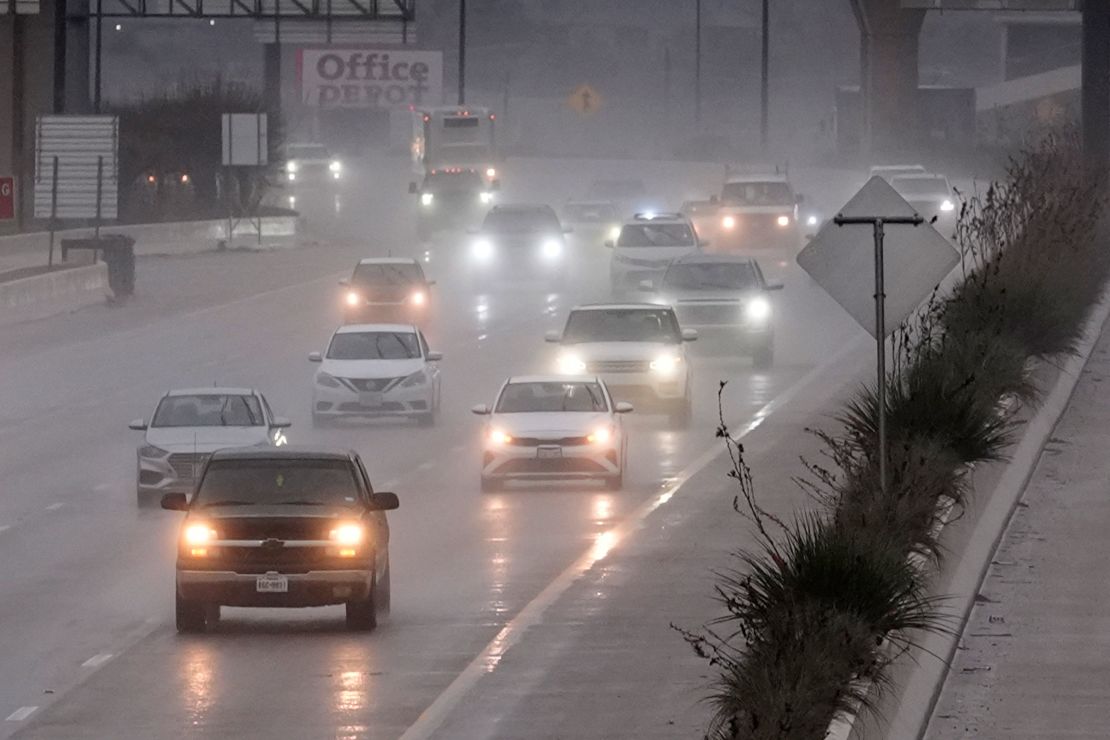 Vehicles make their way on a rain soaked highway in Dallas, Texas, on December 26.