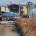 Fire engines work to extinguish a fire at the Muan International Airport in Muan, South Korea, Sunday, Dec. 29, 2024. (Maeng Dae-hwan/Newsis via AP)