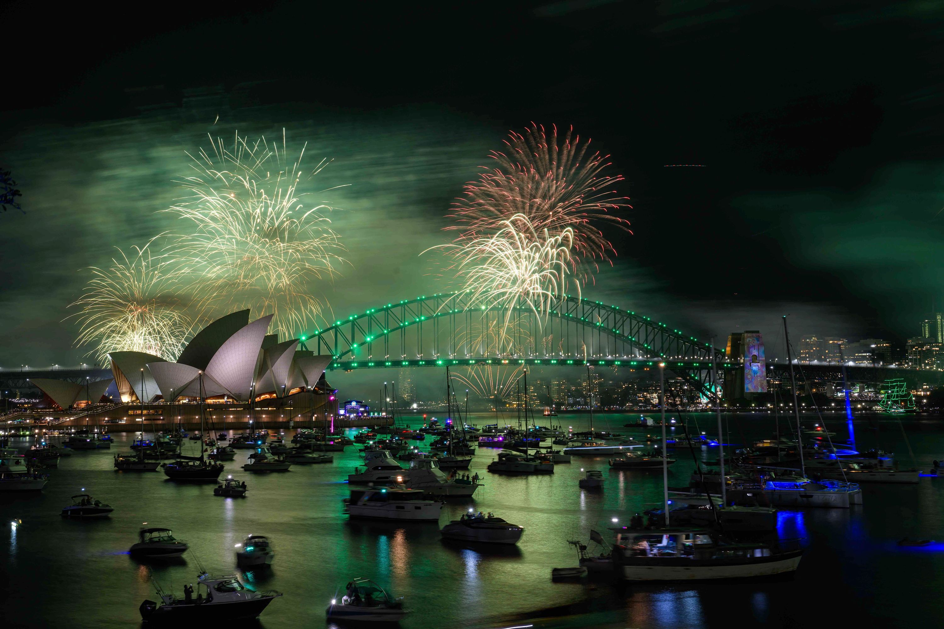 Fireworks explode over the Sydney Opera House.