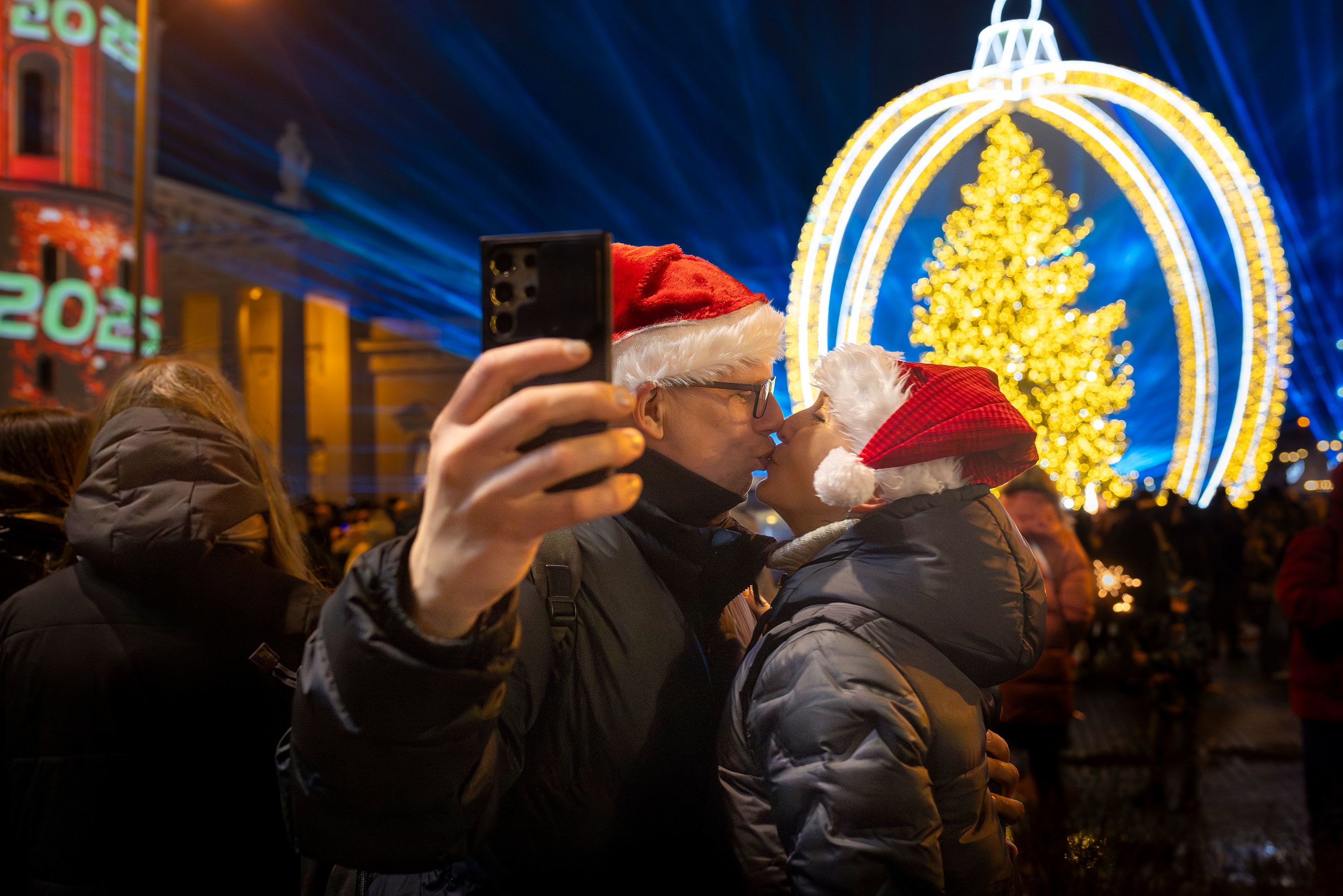 A couple kisses as they celebrate the new year in Vilnius, Lithuania.