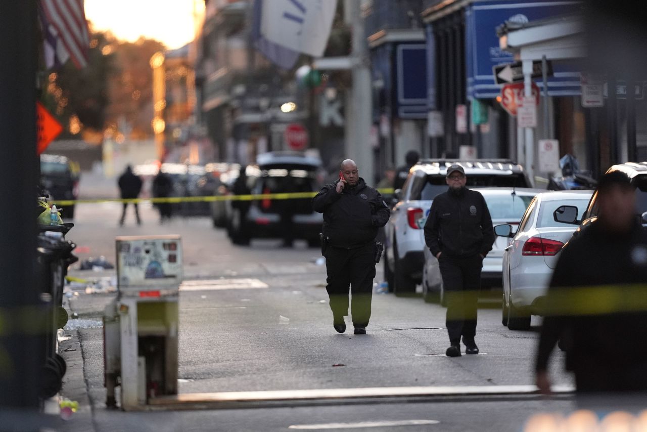 A mechanical barricade, in the foreground of this photo, was in a flat position to allow vehicle access early Wednesday morning after the attack.