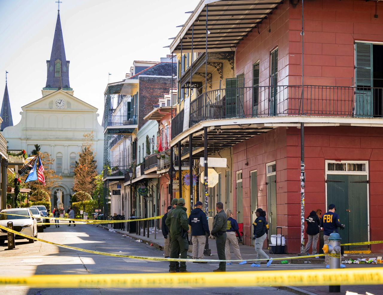 The FBI investigates the area by the St. Louis Cathedral in the French Quarter on Bourbon Street in New Orleans on Wednesday.