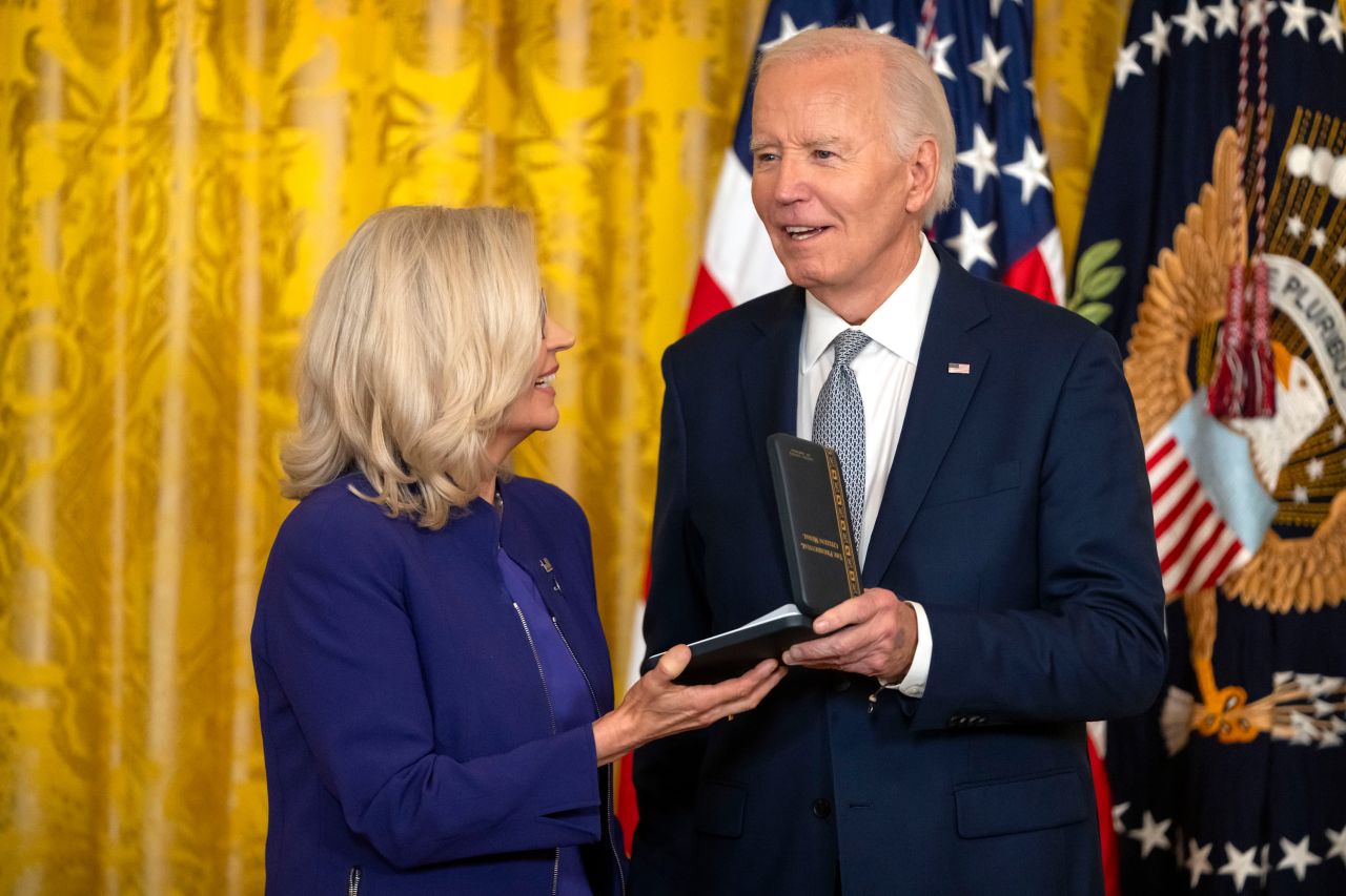 President Joe Biden awards the Presidential Citizens Medal to former Rep. Liz Cheney at the White House.