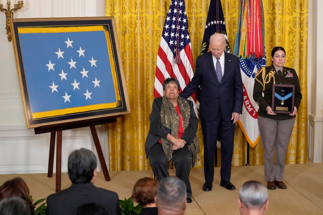 Juanita Mendez accepts the Medal of Honor posthumously on behalf of her brother, Private First Class Charles Johnson, from President Joe Biden.