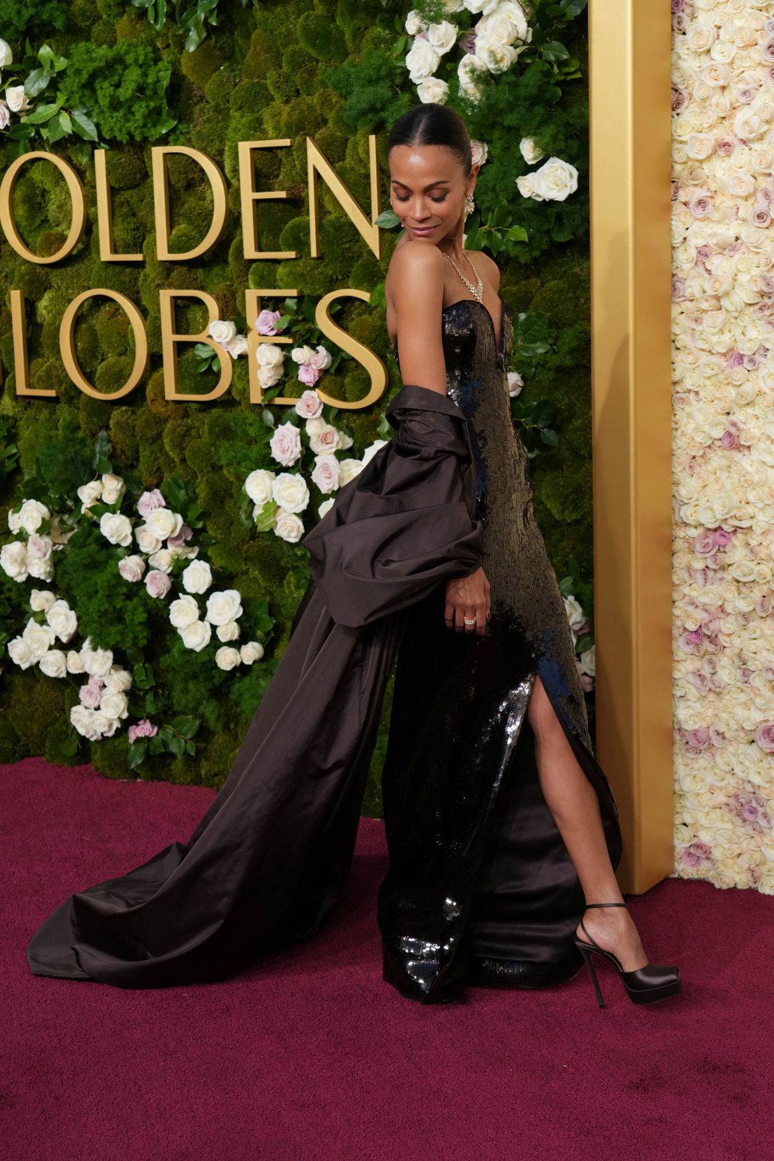 Zoe Saldaña, nominated for her role in "Emilia Pérez," wore a sequin dress and silk taffeta cape by Saint Laurent.