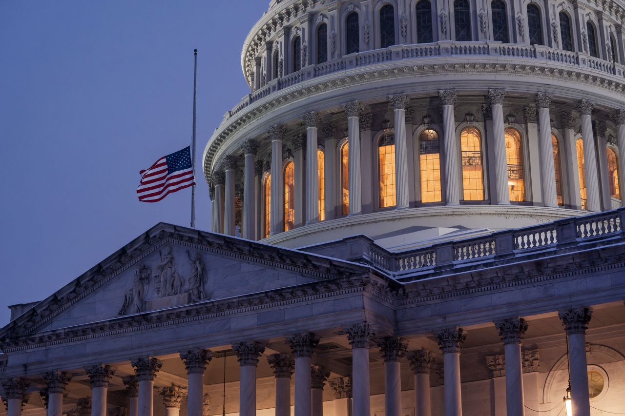 The flag atop the US Capitol flies at half-staff in honor of former President Jimmy Carter on Monday.