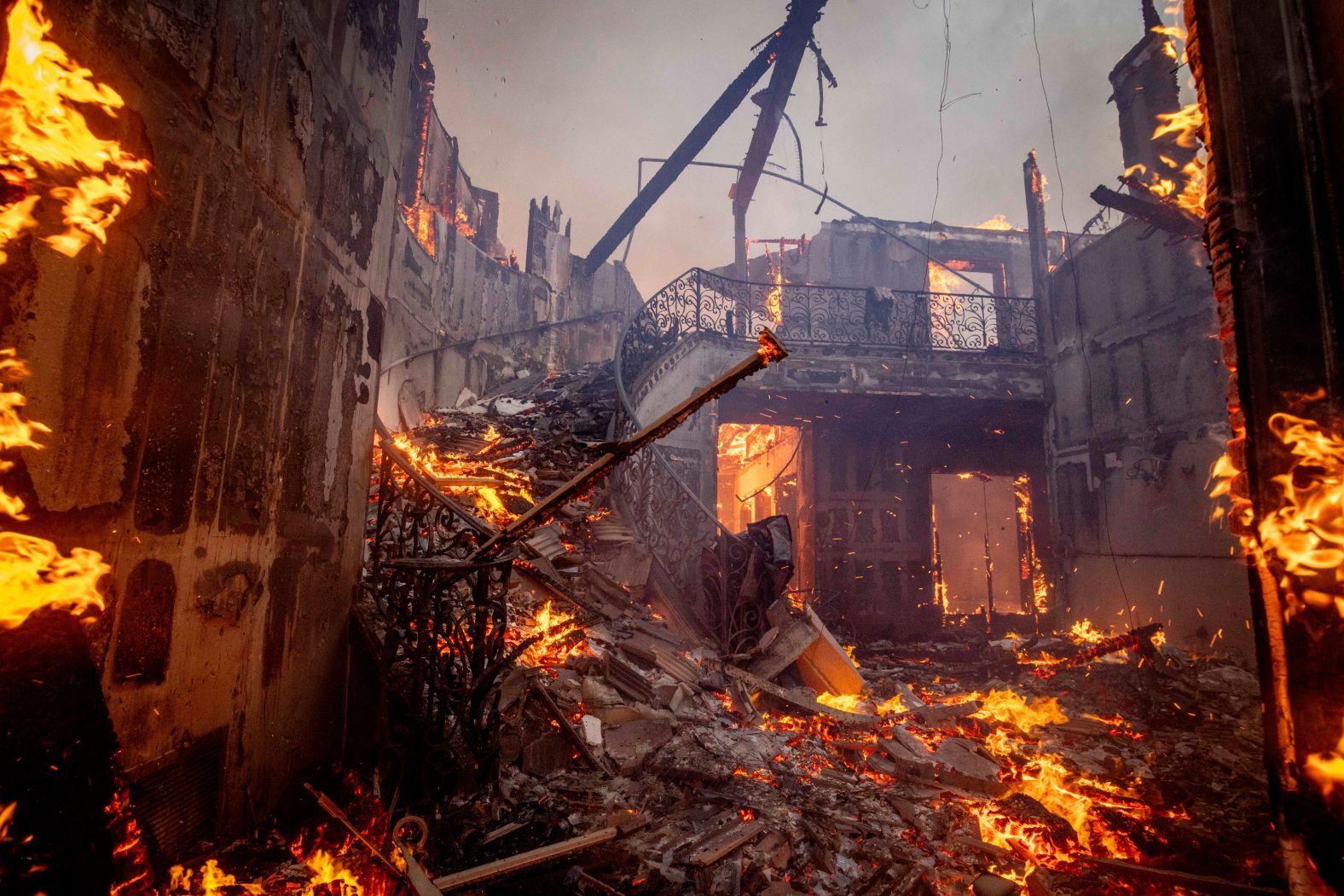 A home burns in Pacific Palisades.