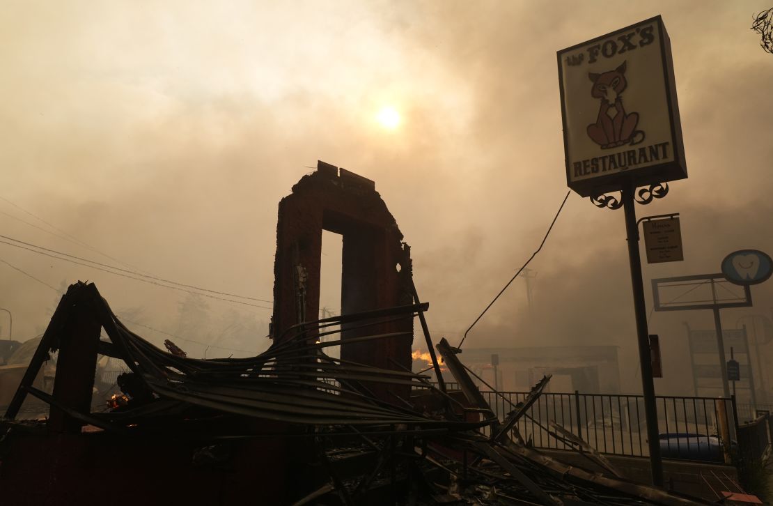 Smoke surrounds the charred remains of Fox's Restaurant in downtown Altadena on January 8.
