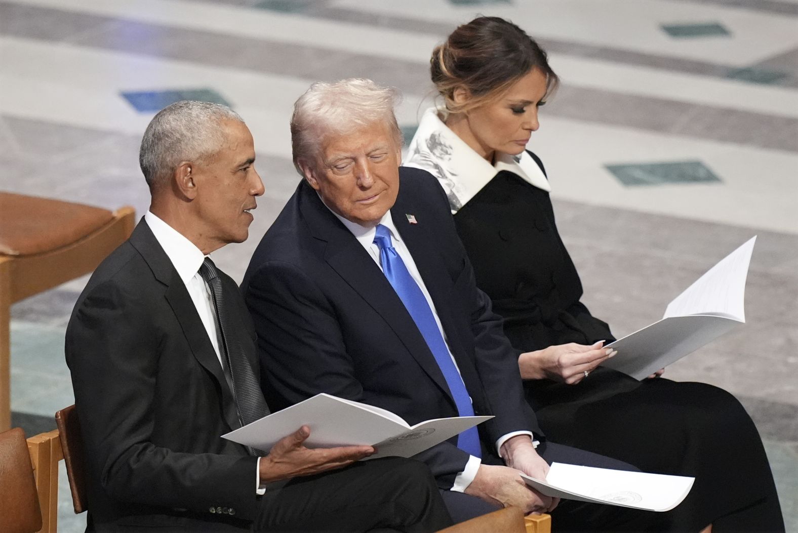 Obama and Trump talk before the funeral.