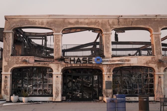 A Chase bank branch is damaged by the Palisades Fire in the Pacific Palisades neighborhood of Los Angeles, Thursday, Jan. 9, 2025. (AP Photo/Jae C. Hong)