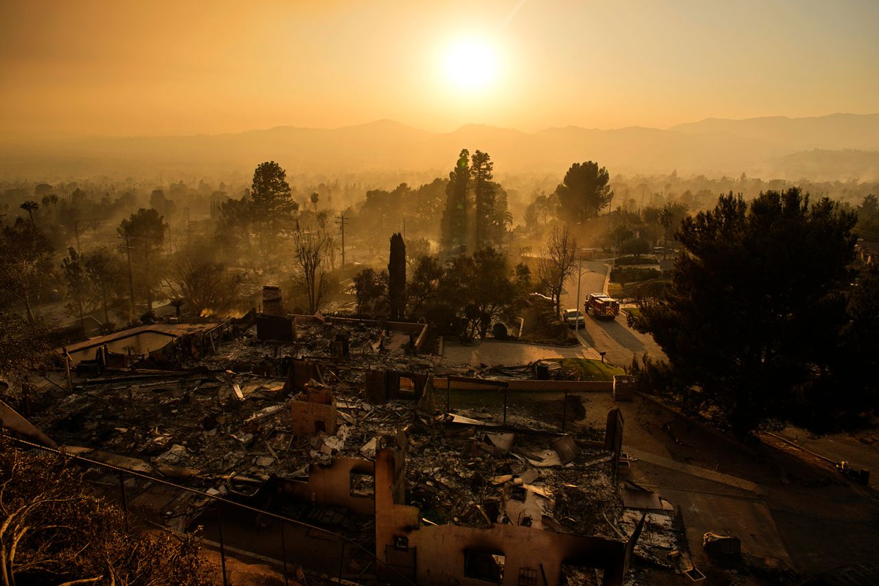 An emergency vehicle drives through a neighborhood devastated by the Eaton Fire, in Altadena, California on January 9.