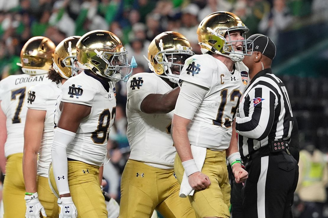 Notre Dame quarterback Riley Leonard (13) celebrates after scoring a touchdown during the second half of the Orange Bowl NCAA College Football Playoff semifinal game against Penn State.