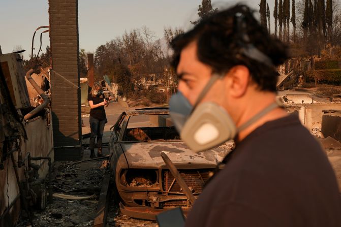 Homeowners Sohrab Nafici and Christine Meinders return to their fire-ravaged neighborhood in Altadena.