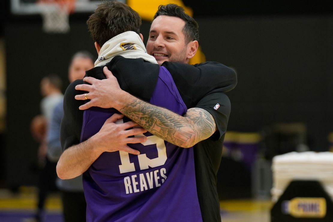 Redick and Reaves hug during a Lakers practice session.