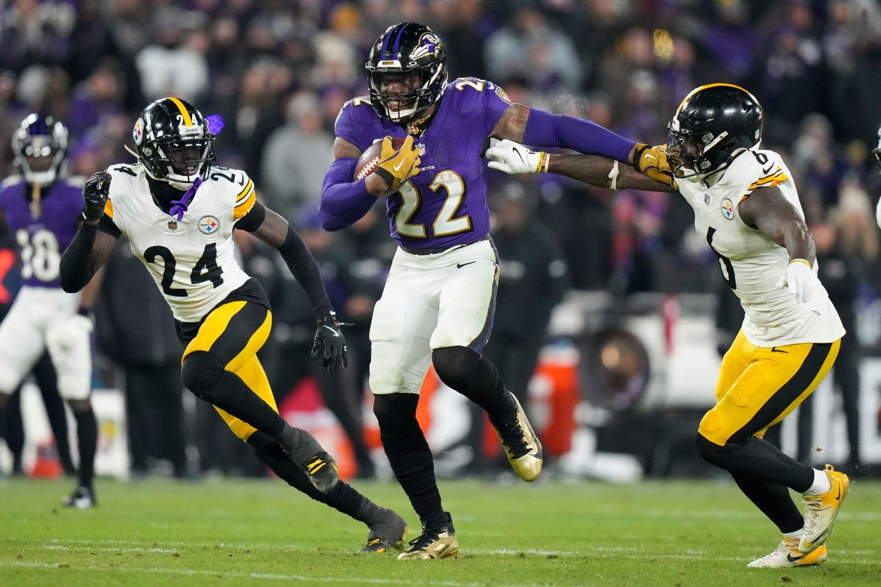 Baltimore Ravens running back Derrick Henry breaks away from Pittsburgh defense on his way to scoring a rushing touchdown.