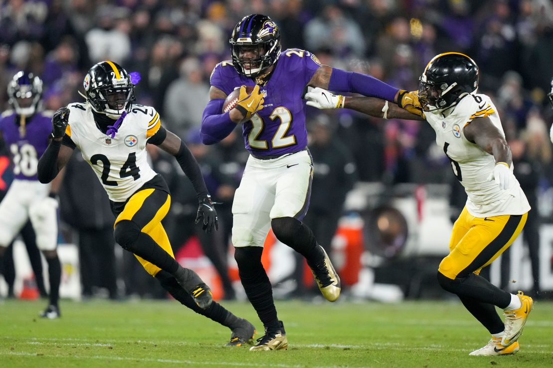 Ravens running‍ back Derrick Henry breaks away from Steelers linebacker Patrick Queen and cornerback Joey Porter‍ Jr. on his way to scoring a rushing touchdown.