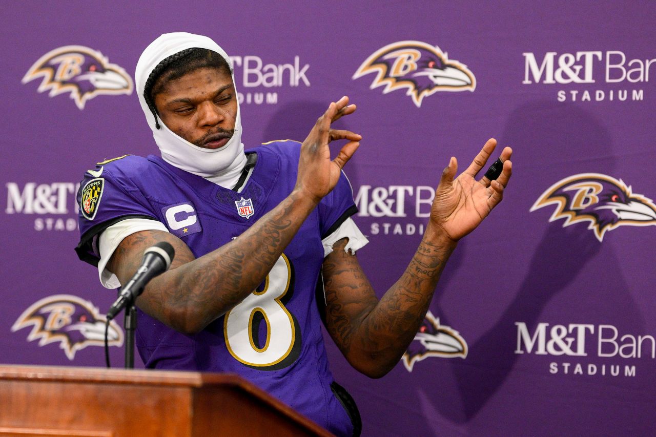 Baltimore Ravens quarterback Lamar Jackson talks to reporters following the game.