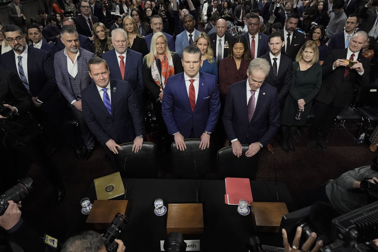 Pete Hegseth, center, President-elect Donald Trump's choice to be Defense secretary, arrives to appear before the Senate Armed Services Committee for his confirmation hearing, at the Capitol in Washington, Tuesday, Jan. 14, 2025.