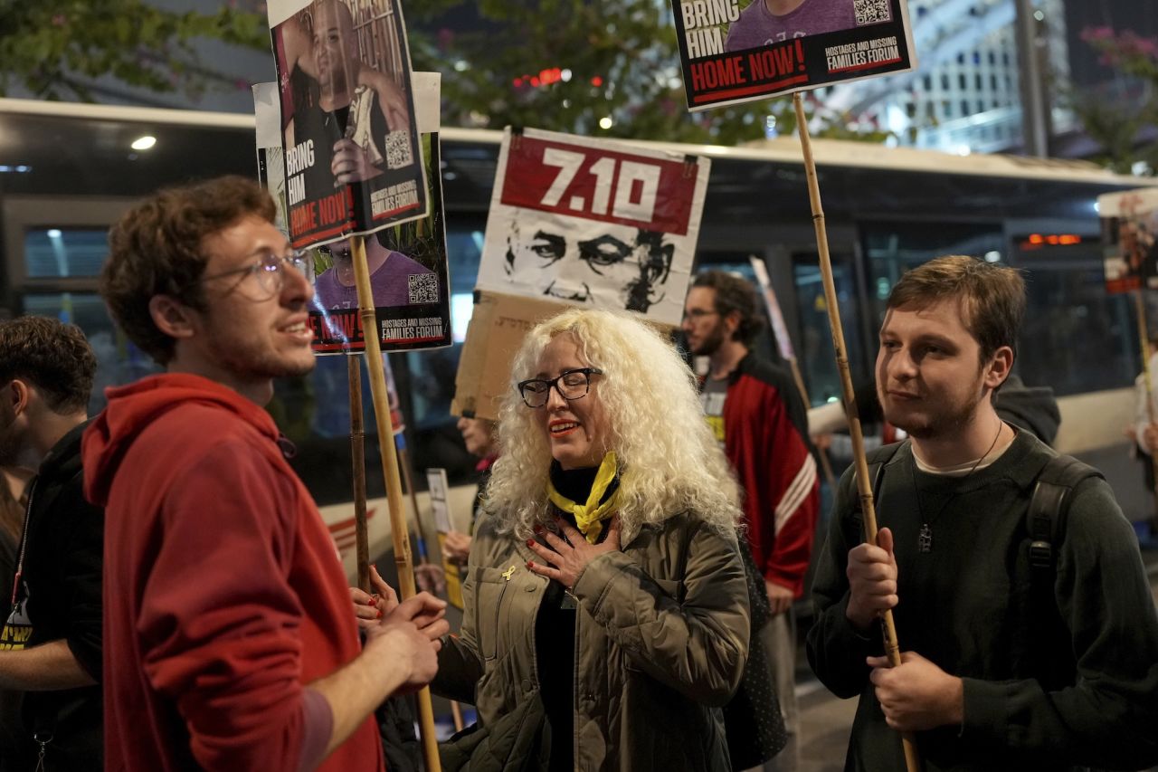 Relatives and friends of people killed and abducted by Hamas react to the ceasefire announcement as they take part in a demonstration in Tel Aviv.