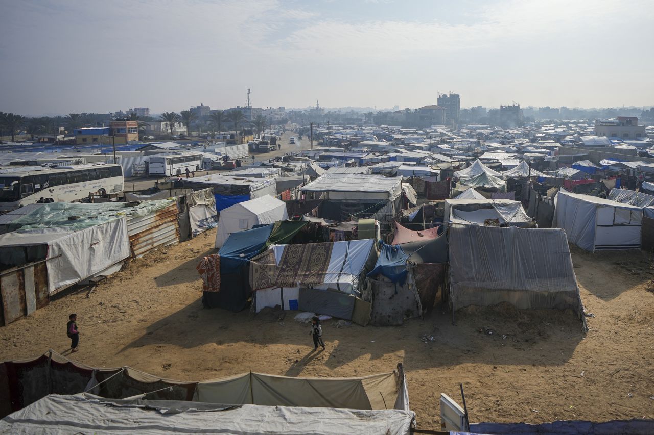 Palestinian children play among the tents at a camp for displaced Palestinians in Deir al-Balah, central Gaza Strip, on Thursday.