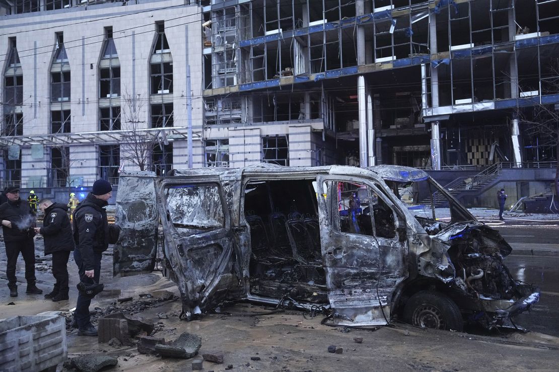 Police officers collect evidence following the Russian missile attack in Kyiv. (AP Photo/Efrem Lukatsky)