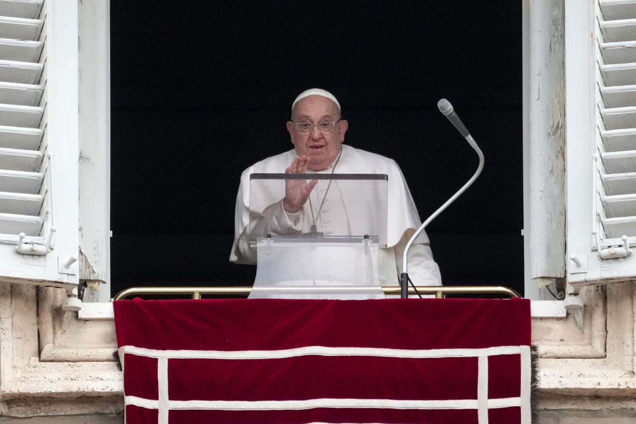 Pope Francis speaks from the window of his studio overlooking St. Peter's Square at the Vatican on Sunday.