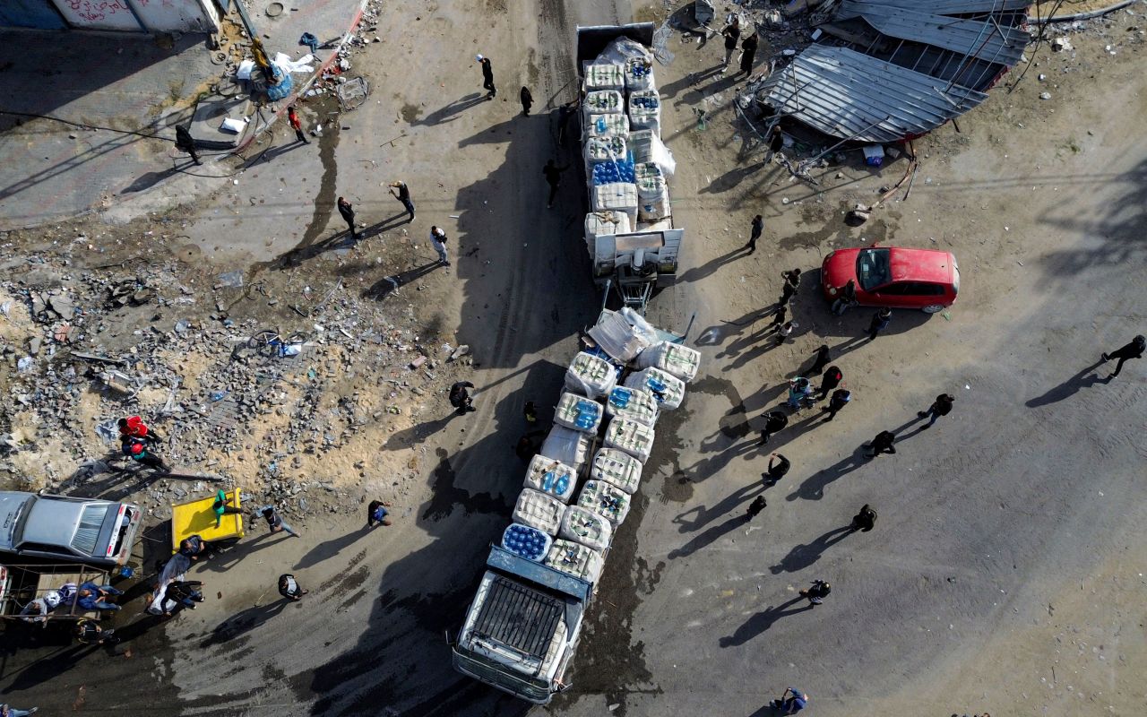 A drone photo shows humanitarian aid trucks entering from Egypt into Gaza through the Kerem Shalom crossing Sunday.