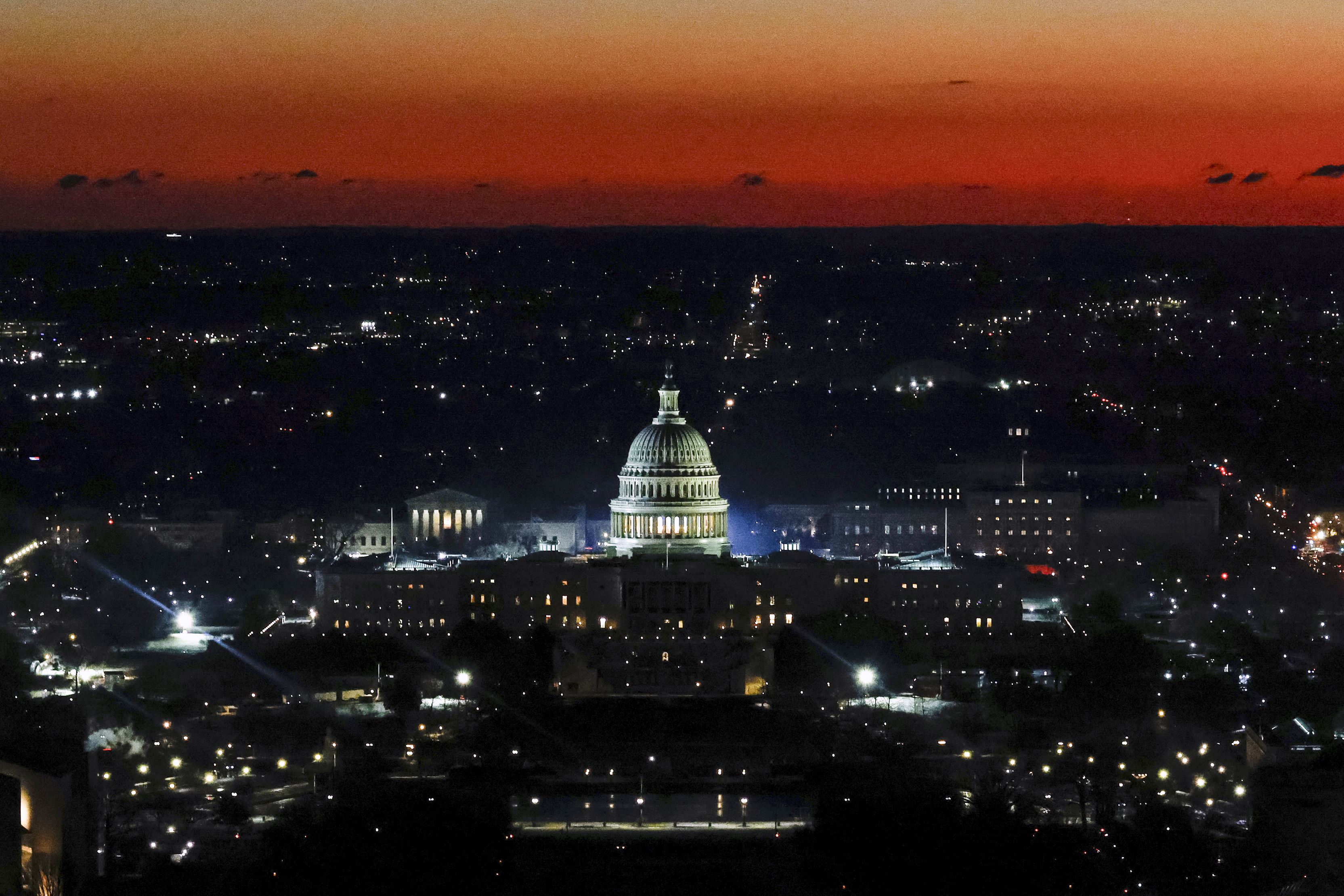 The US Capitol is seen from the top of the Washington Monument at dawn on Monday.