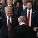 Donald Trump is sworn in as the 47th president of the United States by Chief Justice John Roberts as Melania Trump holds the Bible during the 60th Presidential Inauguration in the Rotunda of the U.S. Capitol in Washington, Monday, Jan. 20, 2025.