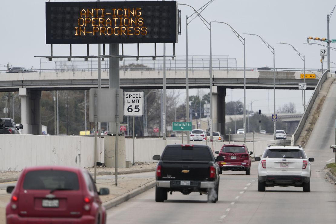 Vehicles pass a sign showing winter storm-related operations Monday in Houston ahead of several inches of snow and possibly ice expected in southeast Texas.