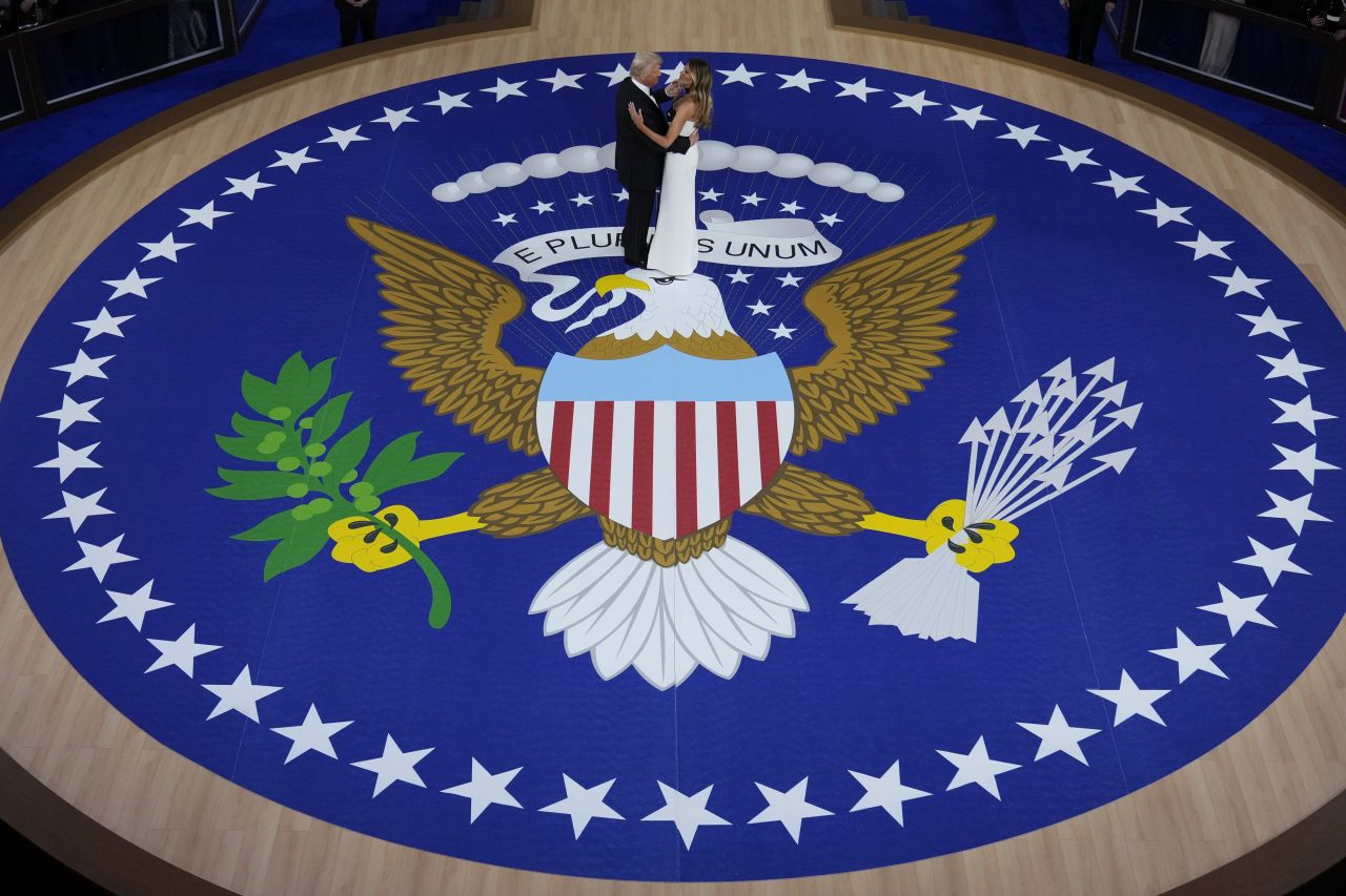 President Donald Trump and first lady Melania Trump dance on Monday.