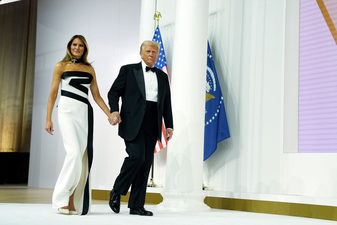 President Donald Trump and first lady Melania Trump walk at the Commander in Chief Ball in Washington on Monday.