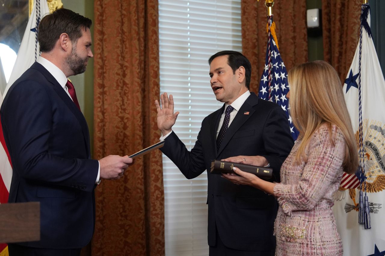 Secretary of State Marco Rubio is sworn by Vice President JD Vance in the Vice Presidential Ceremonial Office in the Eisenhower Executive Office Building on the White House campus, on Tuesday, in Washington, as his wife, Jeanette Rubio, looks on.