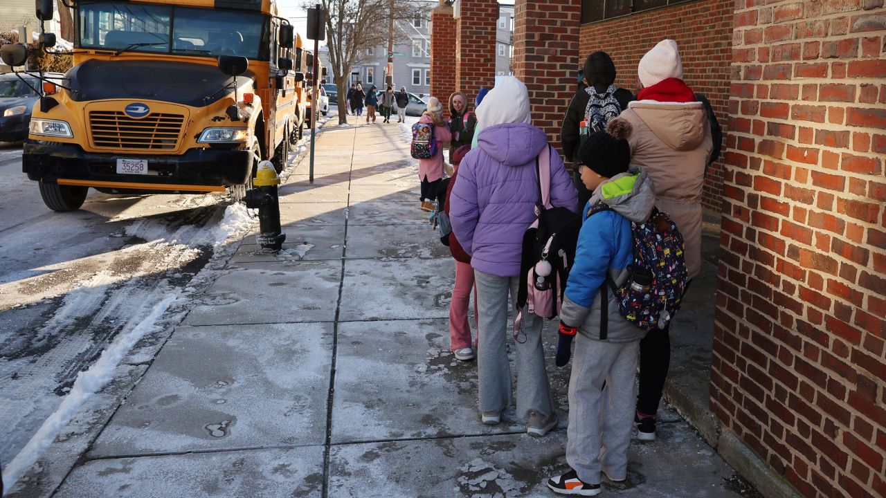 Students arrive for school Tuesday, Jan. 21, 2025, in Boston. (AP Photo/Michael Dwyer)