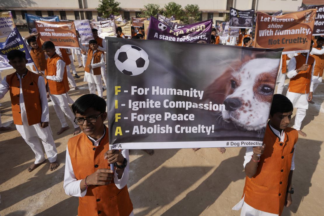 Students in Ahmedabad, India, on January 23 holding banners during a protest in reaction to news reports of mass culling of stray dogs in Morocco as part of a clean up of the streets ahead of the 2030 FIFA World Cup.