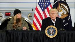 President Donald Trump is briefed on the effects of Hurricane Helene at Asheville Regional Airport in Fletcher, N.C., Friday, Jan. 24, 2025, as first lady Melania Trump looks on. (AP Photo/Mark Schiefelbein)