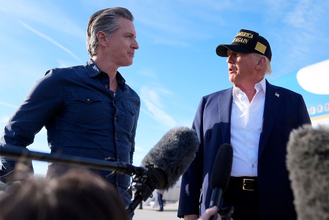 Trump talks with California Gov. Gavin Newsom at Los Angeles International Airport on Friday.