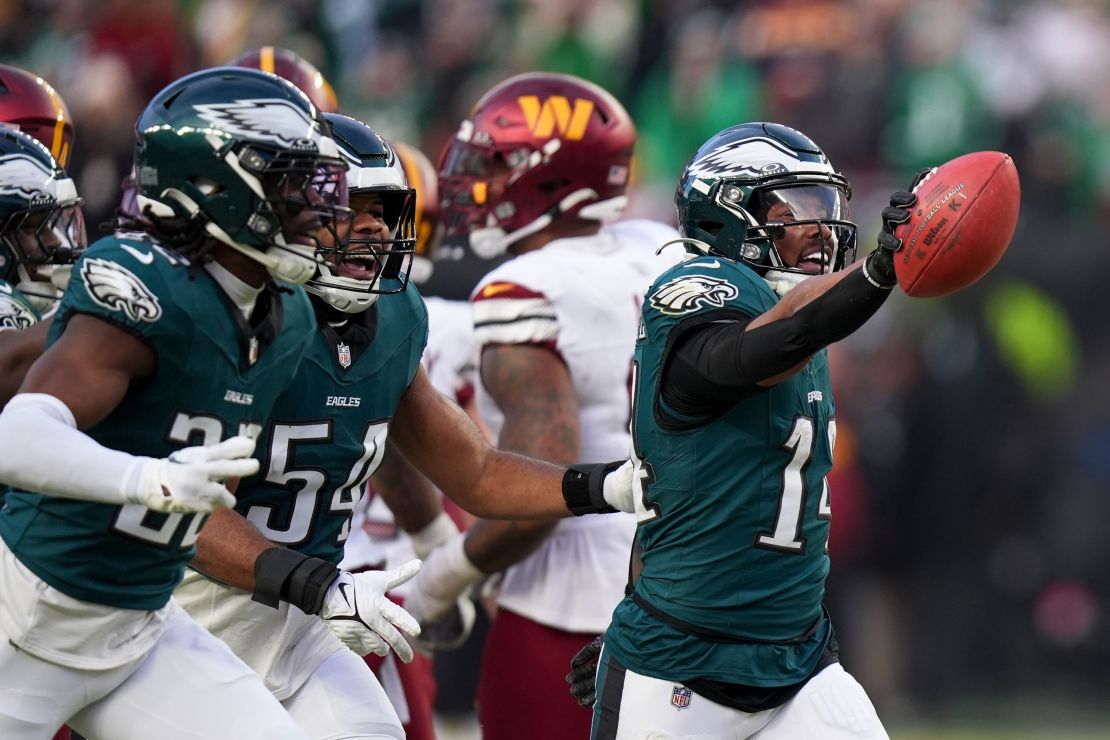 Philadelphia Eagles running ⁤back Kenneth Gainwell celebrates after a ‌fumble recovery against‌ the Washington Commanders.