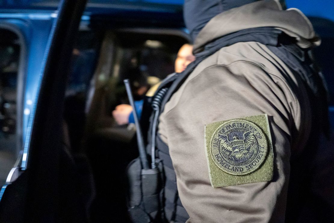 ICE officers detain a person January 27 in Silver Spring, Maryland.