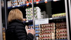 A shopper browses for eggs in front of a sign posted about egg shortages at a PCC Community Markets grocery store Monday, Jan. 27, 2025, in Seattle. (AP Photo/Lindsey Wasson)