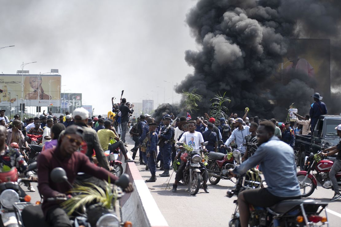 People protest in Kinshasa against the Rwanda-backed M23 rebels' advances on Tuesday.