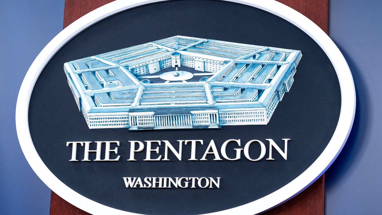 The Department of Defense logo is seen on the wall in the press briefing room at the Pentagon, on October 29, 2024.